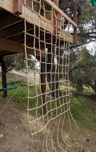 Climbing Net  8" Squares Pro Manila Affordable Quality - picture in use - shows use of top loops to mount to 2x4 - different angle
